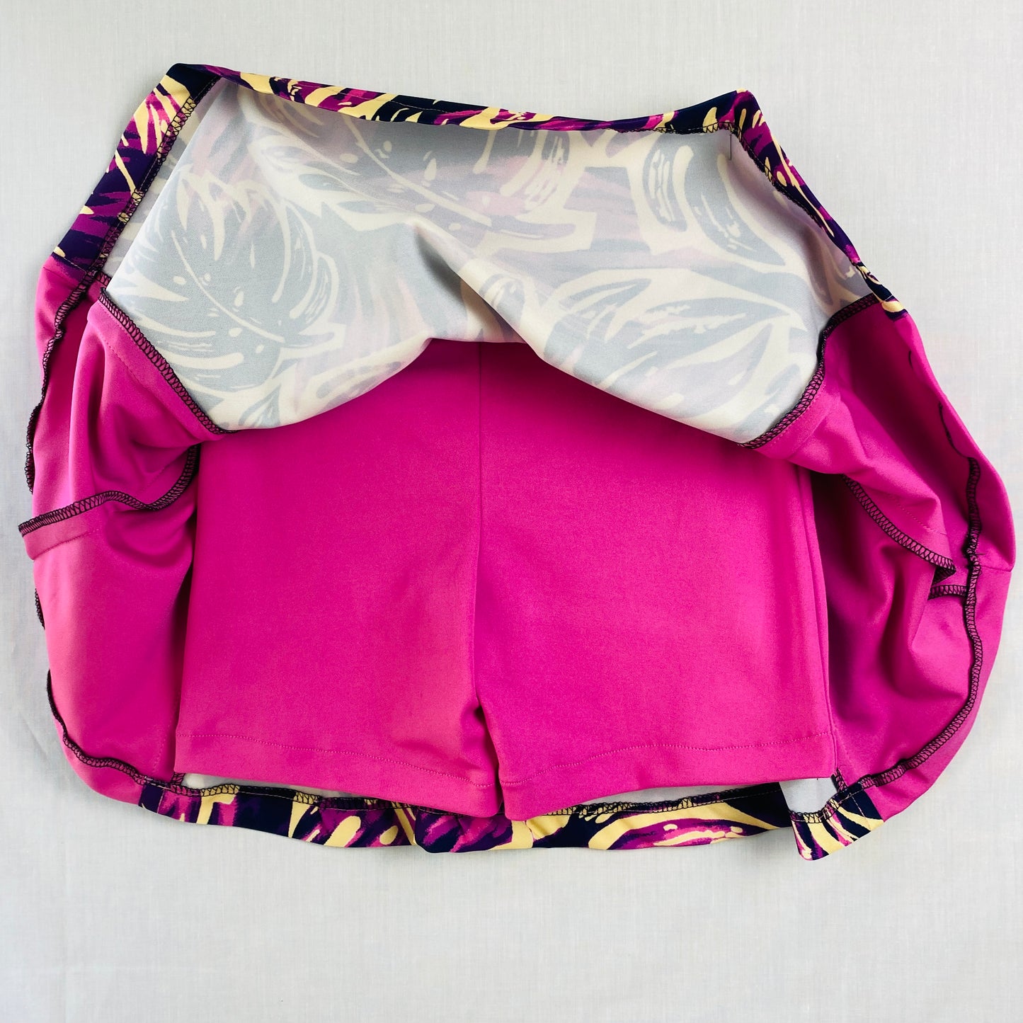 Pickleball Skort for Active Teens (Ages 10–14) – Pink & Purple Tropical Print

Vibrant girls’ pickleball skort featuring a pink and purple tropical print. Made from soft, stretchy polyester & spandex with built-in shorts for comfort and coverage.

Designed for movement, confidence, and all-day active wear.

Perfect for pickleball, tennis, dance, school sports, gym class, and casual outings.

Designed and sewn in Australia.